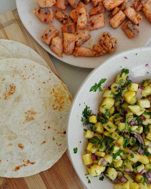 preparing Salmon Tacos with Pineapple Salsa 