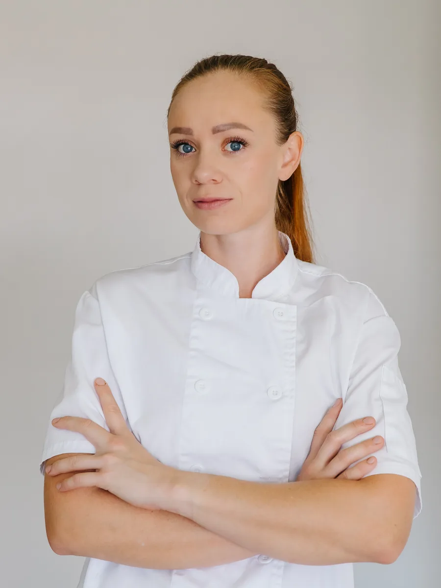 Chef Kseniia in a white chef coat