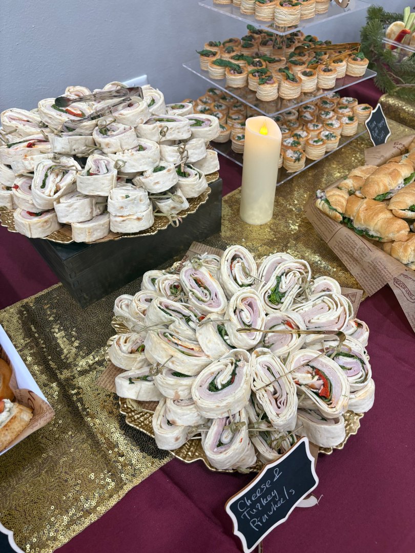 Platters of turkey pinwheel wraps and cheese pinwheel wraps.