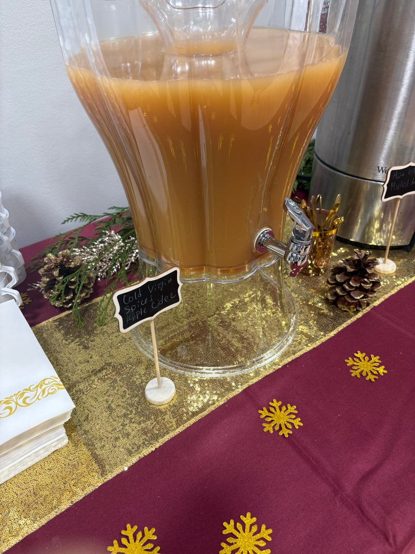 Large dispenser of cold virgin spiced apple cider.