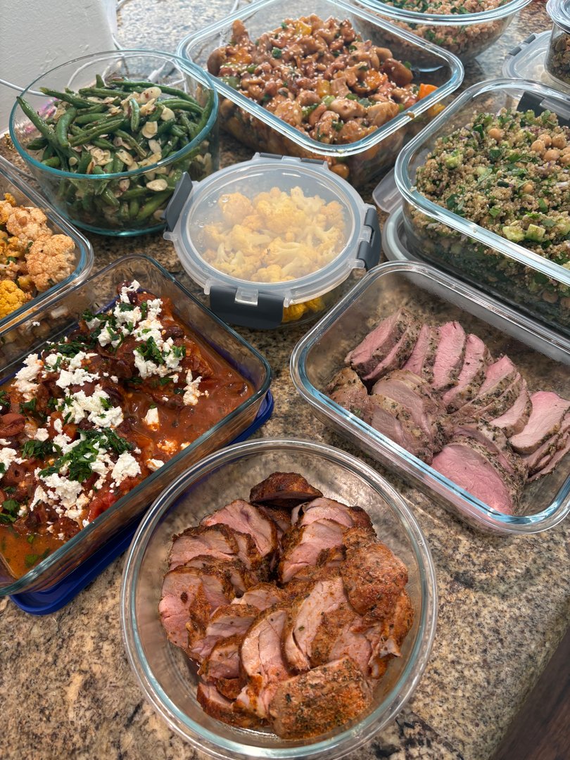 Assortment of Mediterranean and Asian-inspired meal prep containers