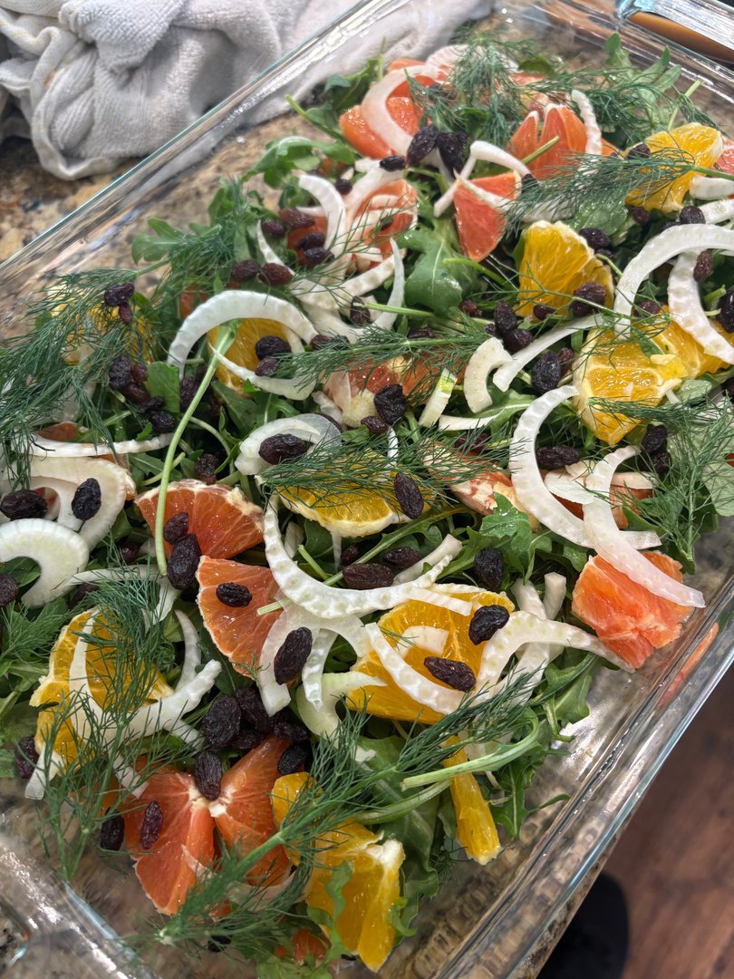 Fresh arugula, citrus, fennel, and raisin salad