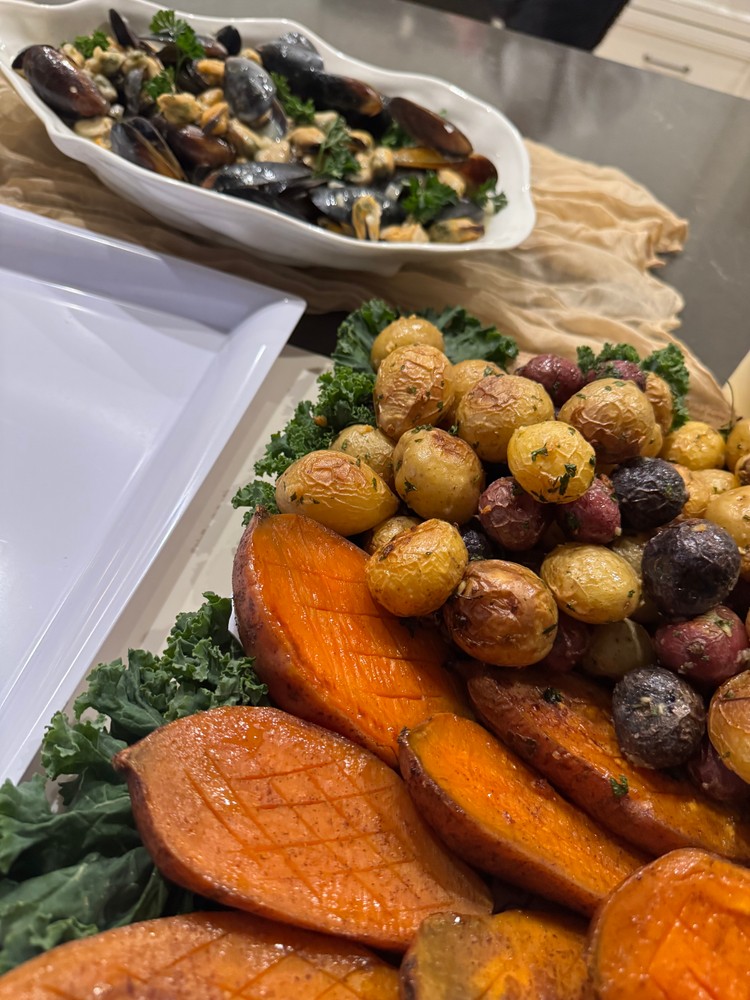 Mussels in creamy wine sauce, maple cinnamon sweet potato halves, and garlic baby potatoes