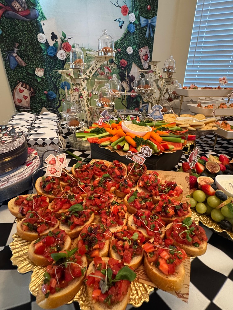 Platter of tomato bruschettas with fresh basil.